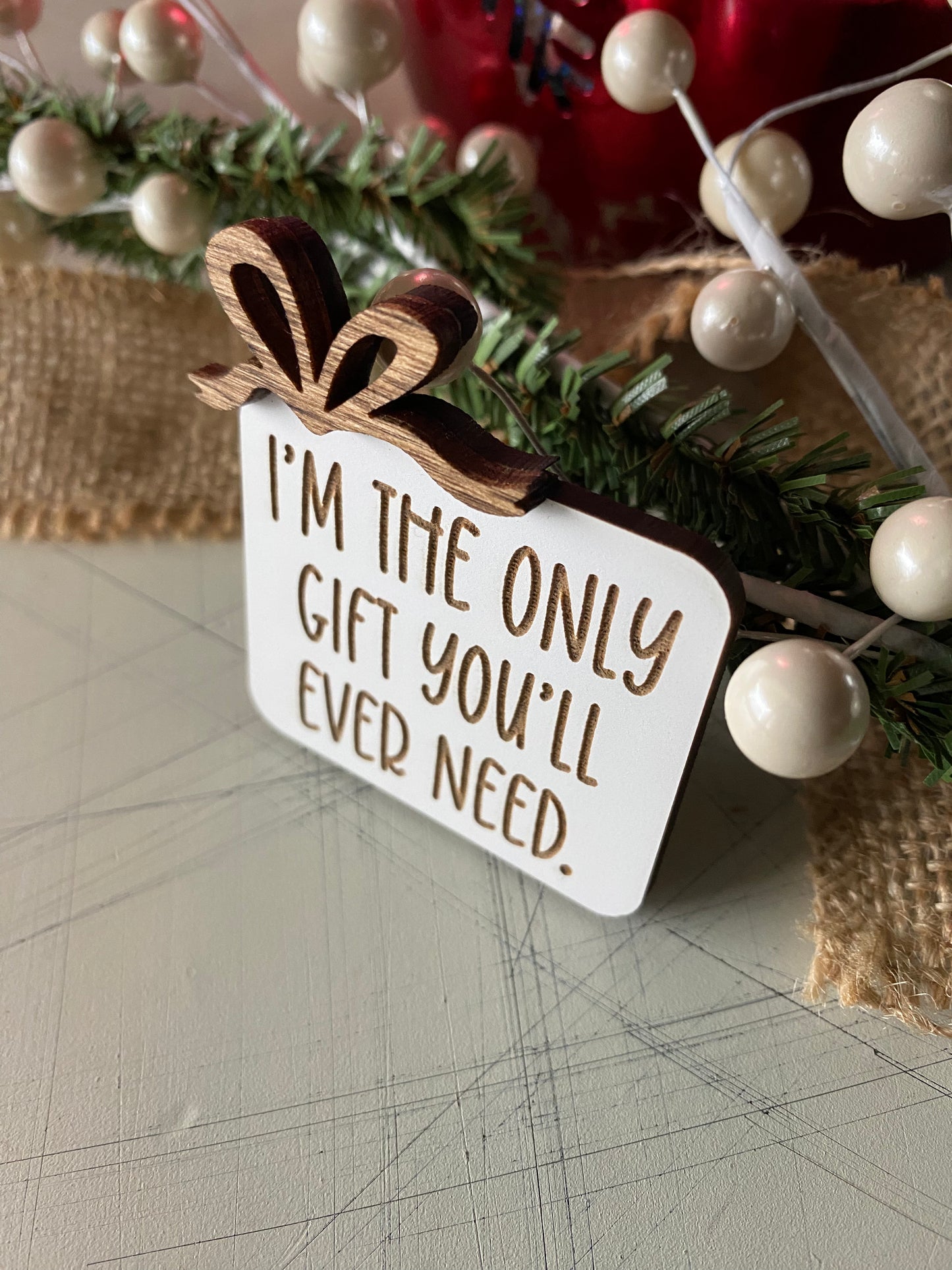 I'm the only gift you'll ever need. - Novotny Designs - funny engraved wood magnet with bow