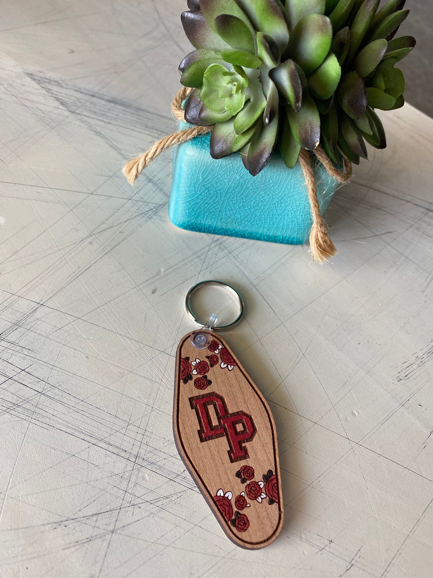 De Pere logo keychain - floral motel style wood keychain by Novotny Designs