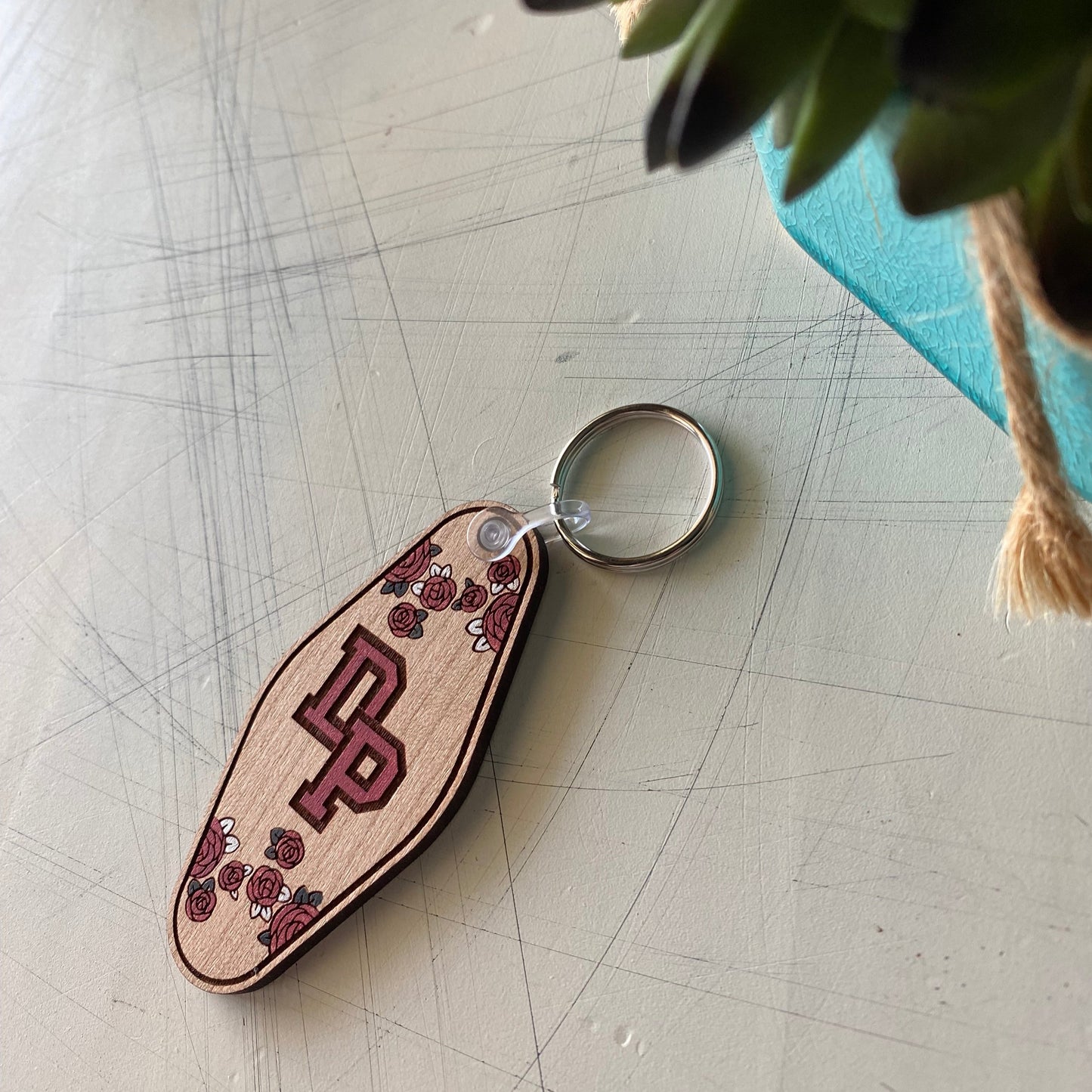 De Pere floral logo keychain - motel style wood keychain by Novotny Designs