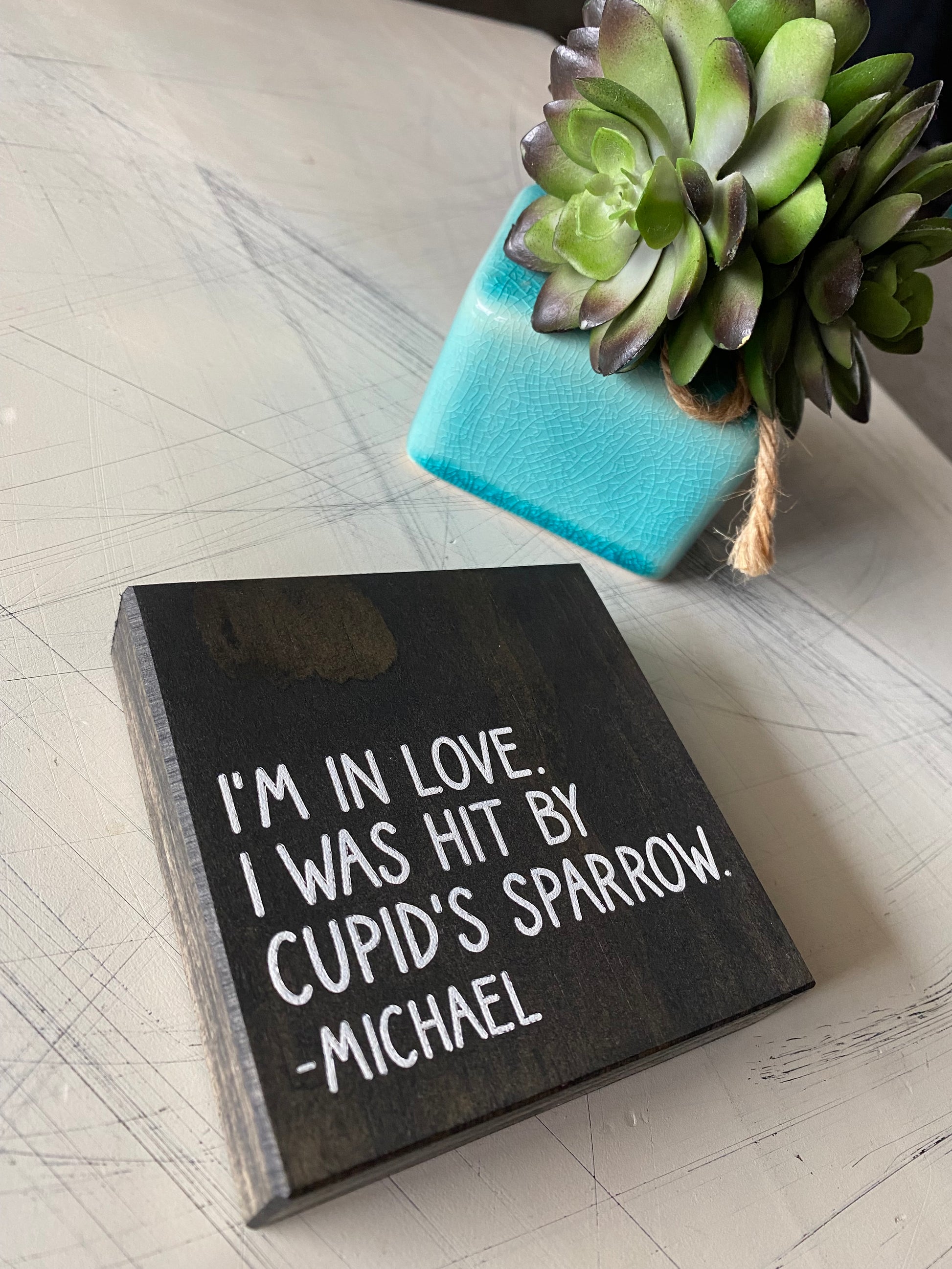 I'm in love. I was hit by cupid's sparrow. - Michael - Novotny Designs mini wood sign in black