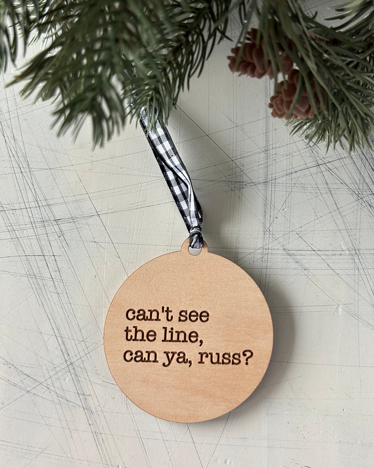 Can't see the line, can ya, Russ? - 3 inch engraved wood ornament by Novotny Designs