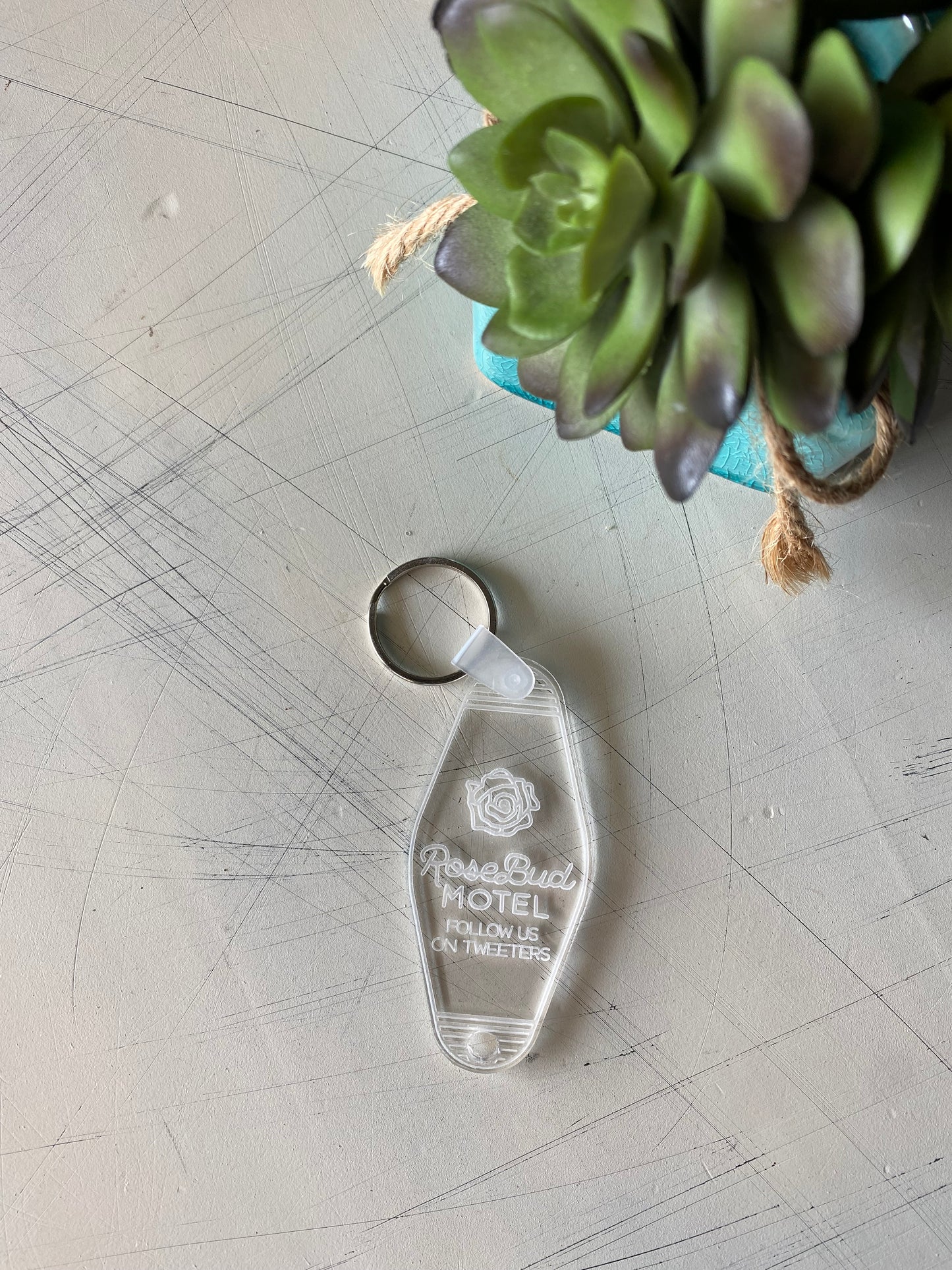 Rosebud Motel - Follow us on Tweeters - acrylic motel-style keychain - Novotny Designs