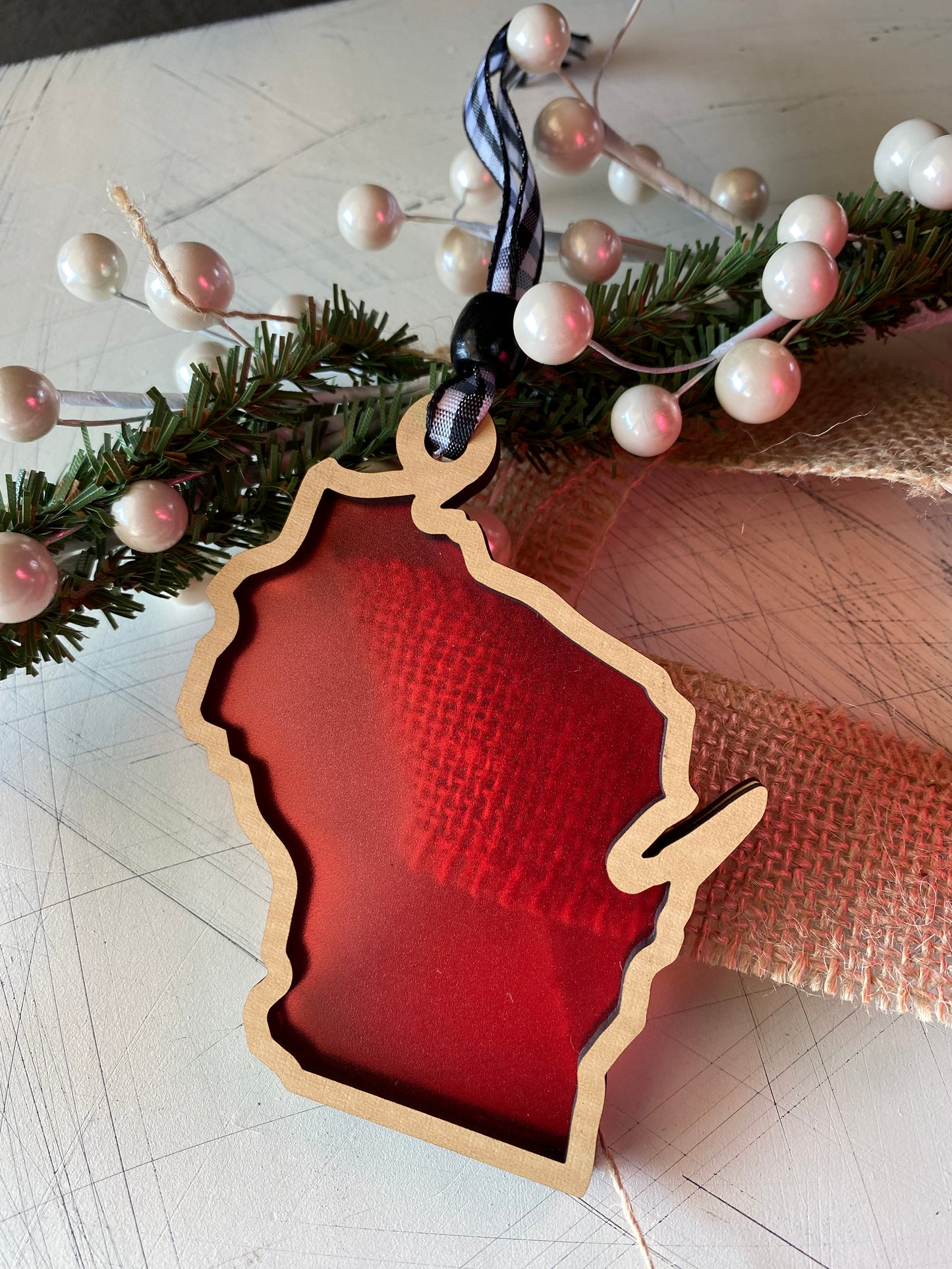 Wisconsin-shaped transparent ornament with buffalo plaid ribbon - Novotny Designs