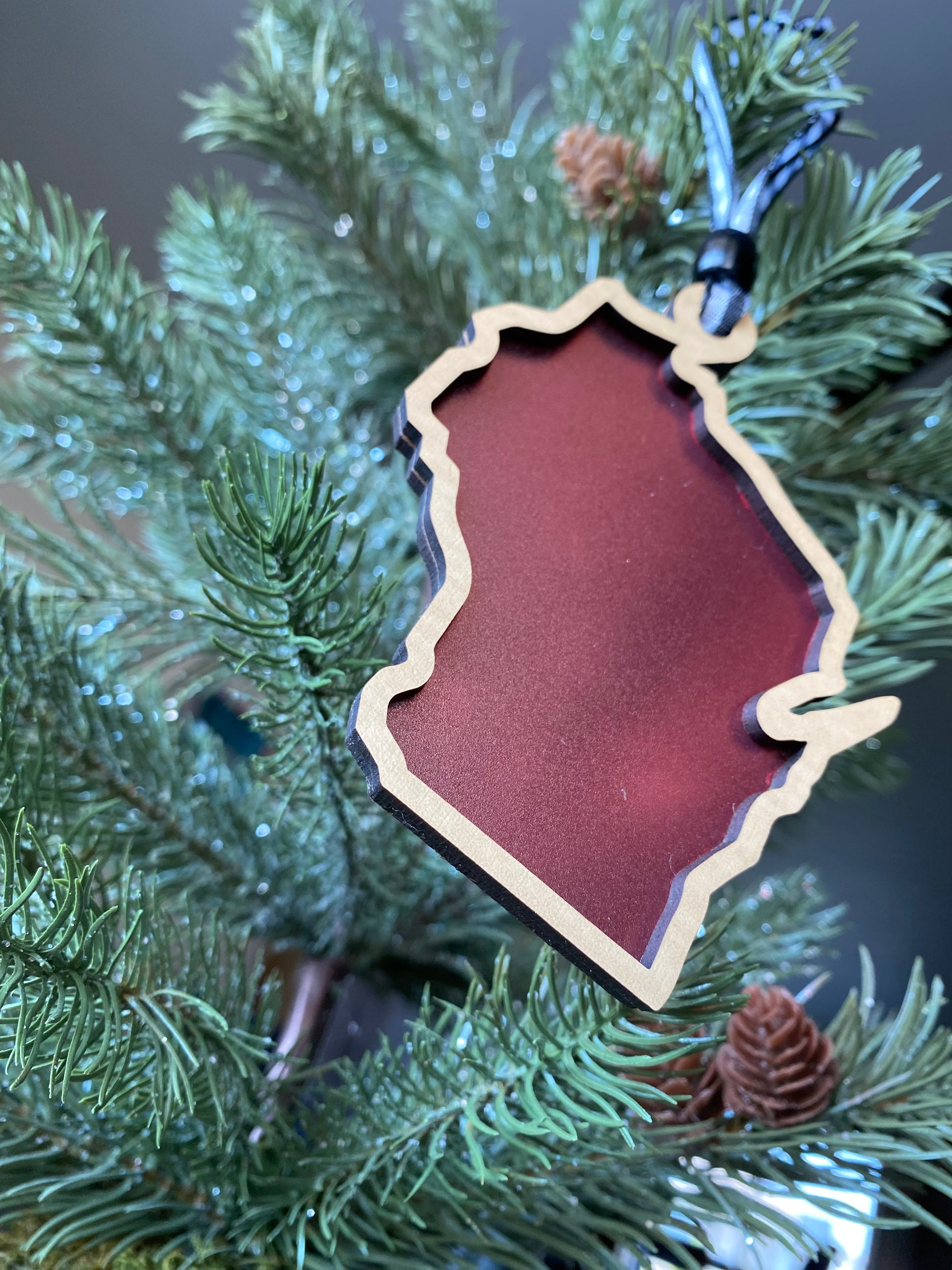 Wisconsin-shaped transparent ornament with buffalo plaid ribbon - Novotny Designs