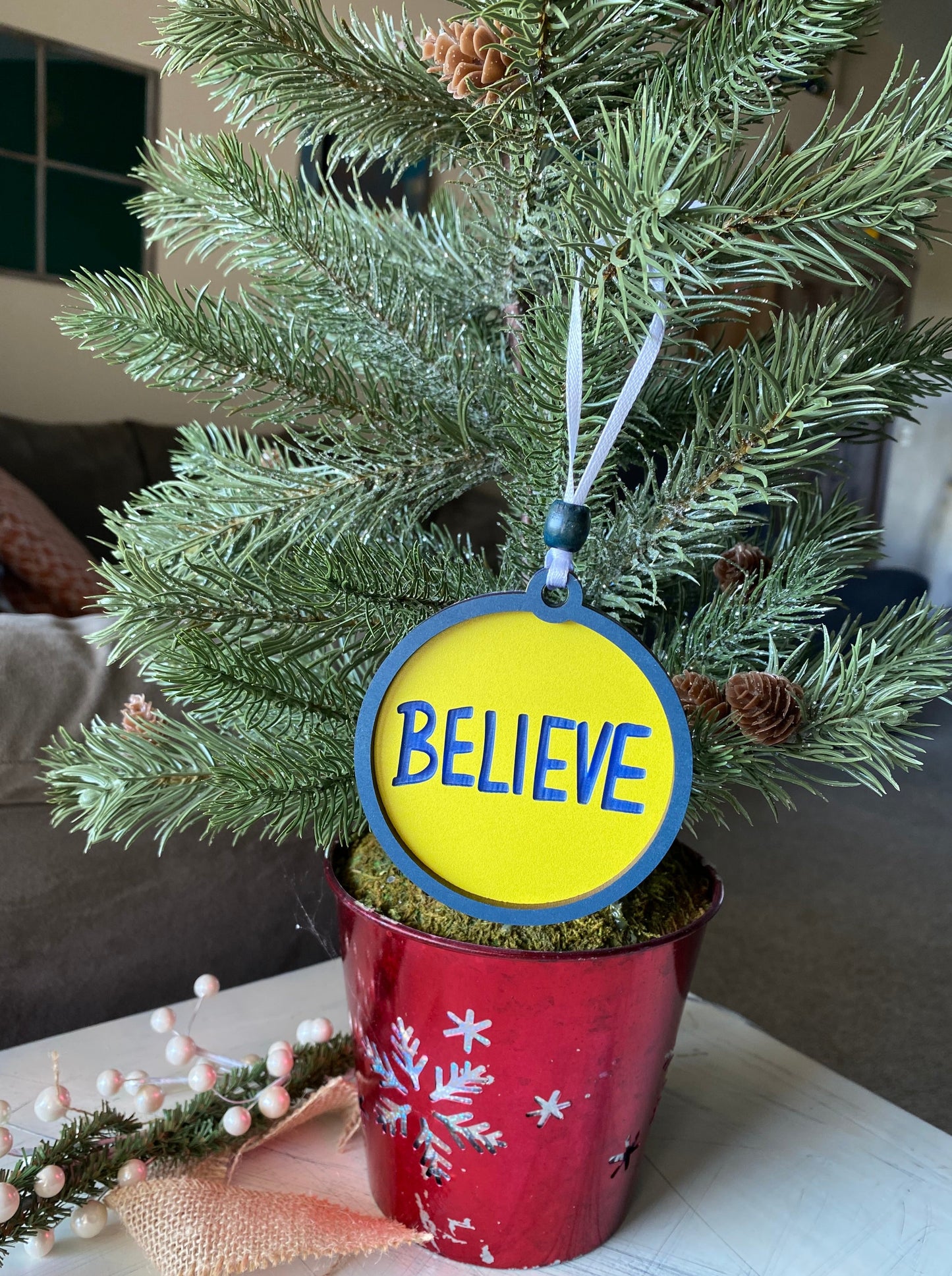 Believe - engraved acrylic blue and yellow 3-inch ornament - Novotny Designs