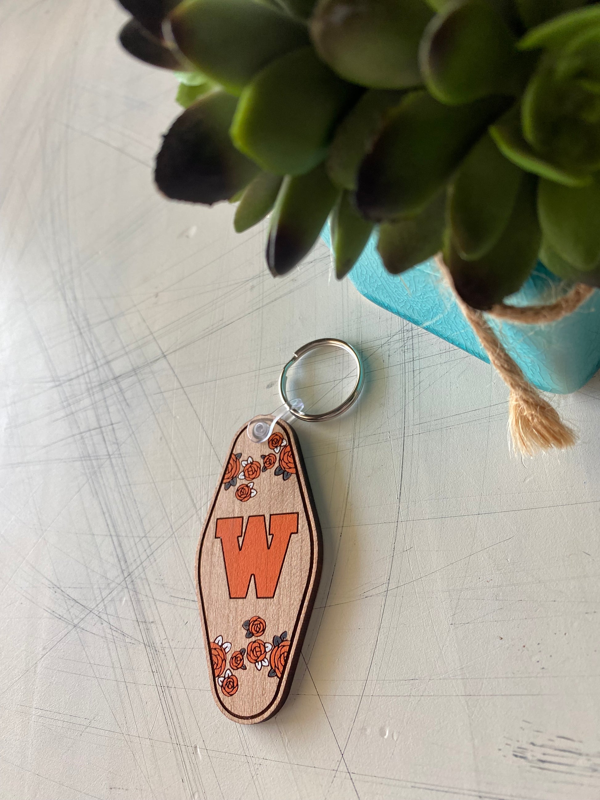 West De Pere logo keychain - floral motel style wood keychain by Novotny Designs