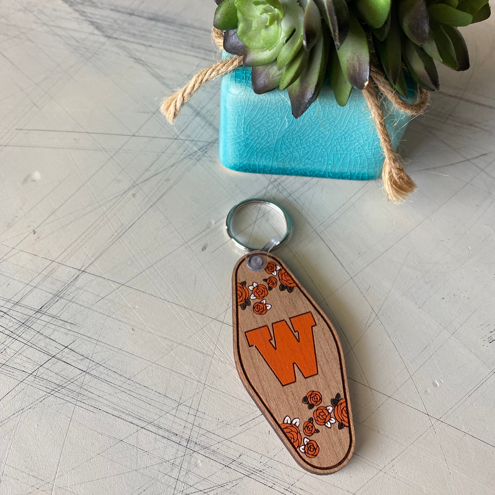 West De Pere logo keychain - floral motel style wood keychain by Novotny Designs