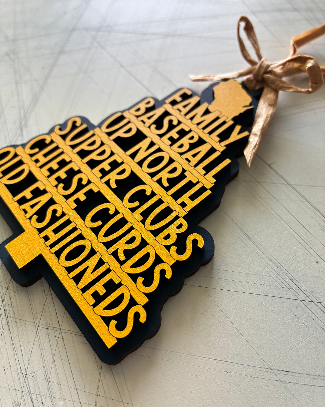 Handmade Wisconsin favorite things tree-shaped ornament in navy blue and yellow by Novotny Designs